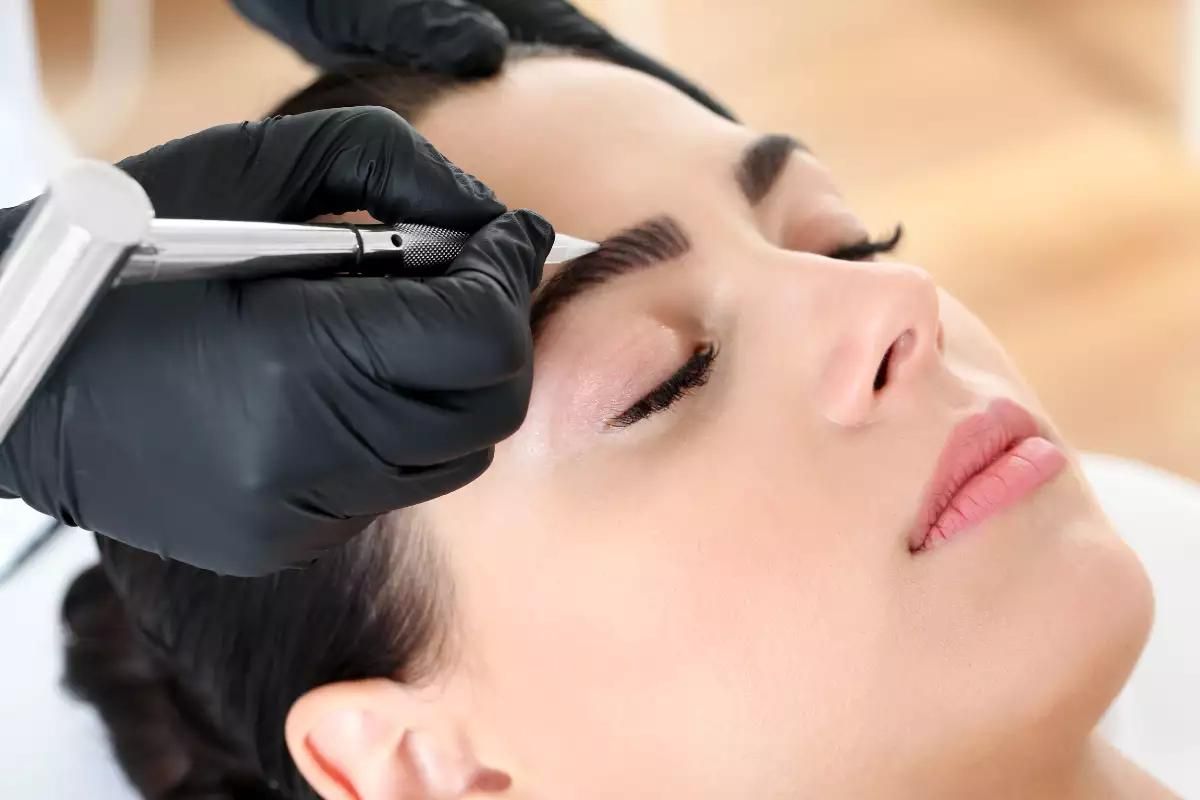 A woman getting a dermaplaning treatment.