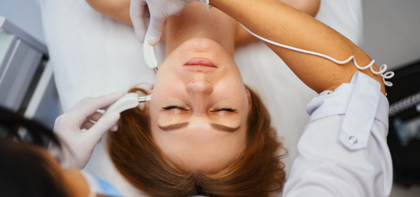 A woman undergoes a galvanic facial treatment because she prefers a non-invasive procedure.