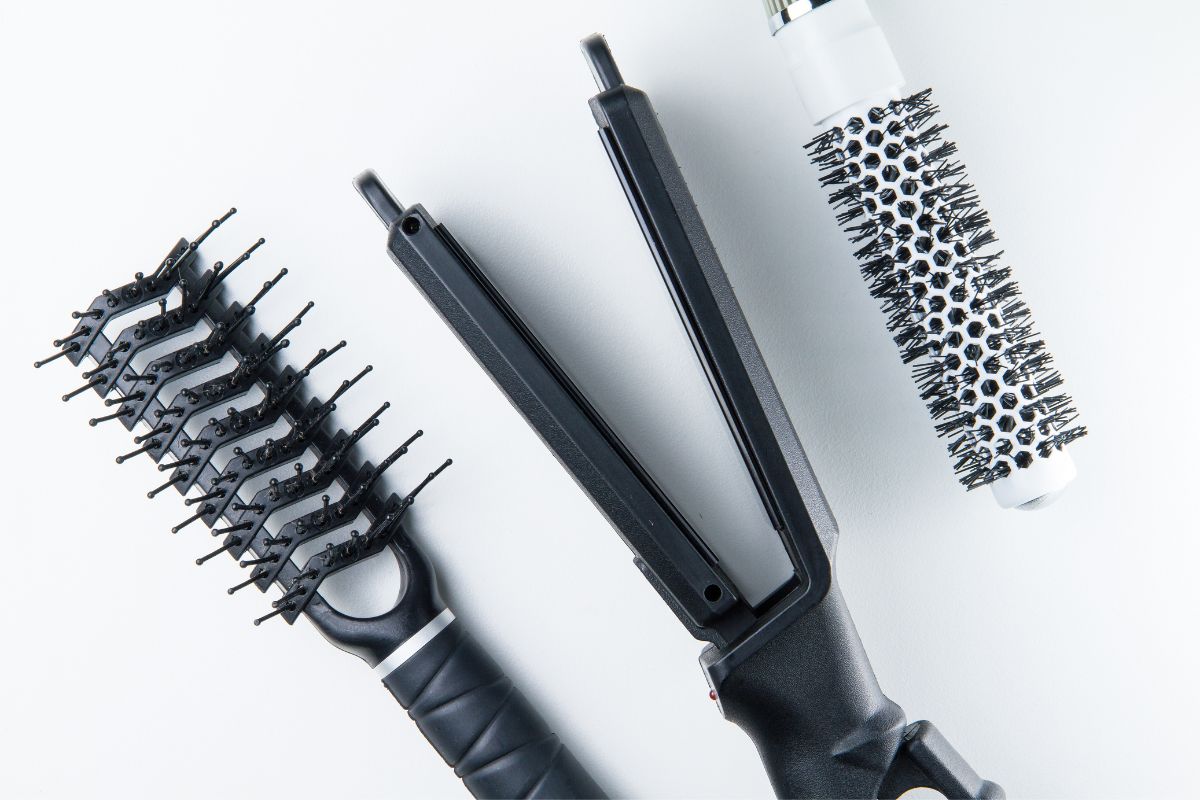 Brush and iron for straightening black hair.