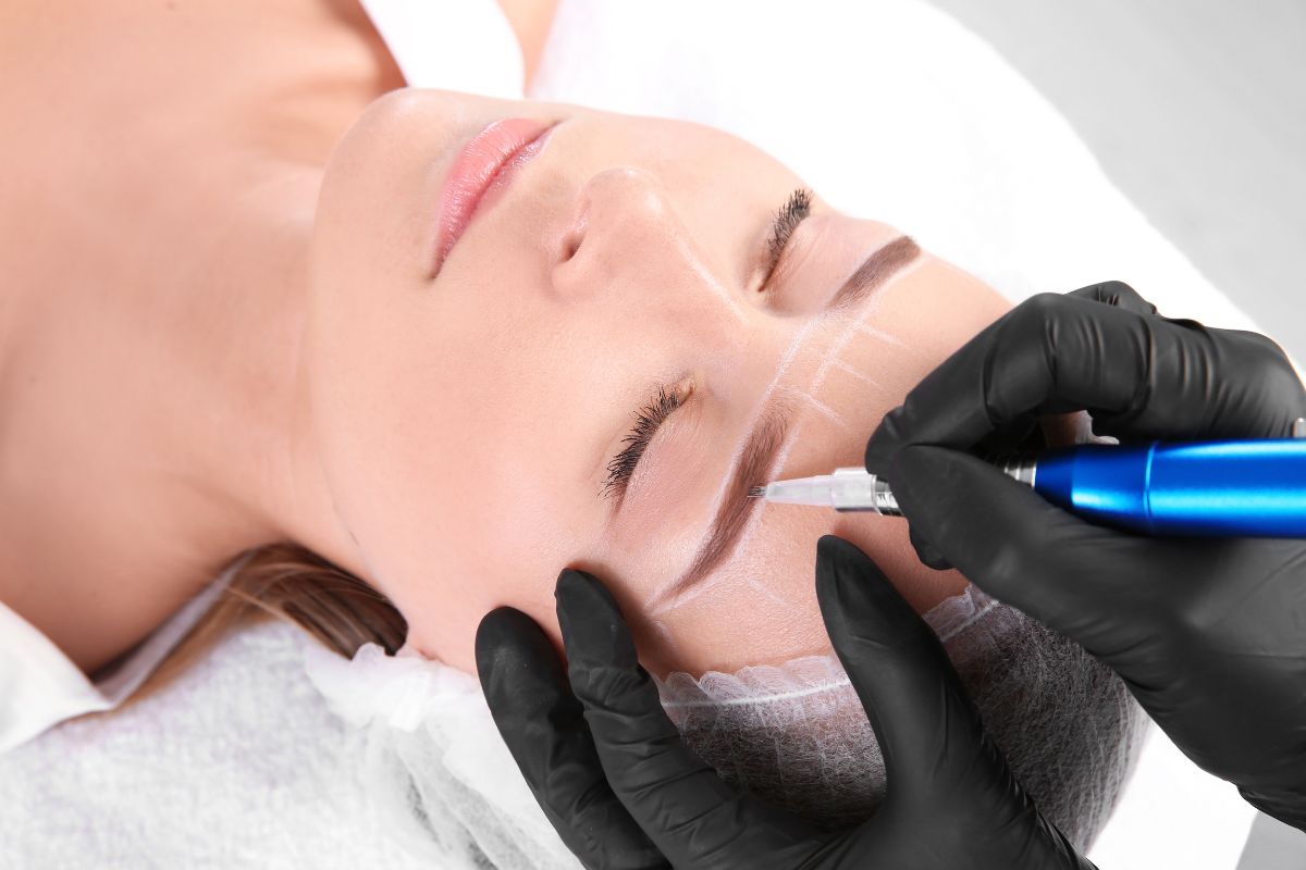 A woman is asking for the aftercare of powder brows while undergoing the semi-permanent cosmetic tattooing techniques.