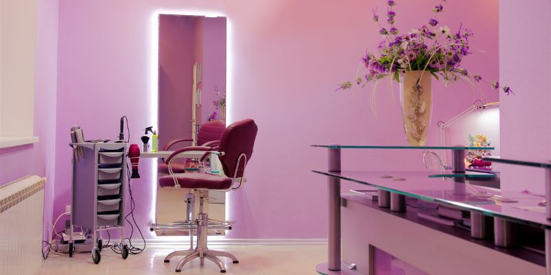 Using blush pink walls is a salon idea that stands out.