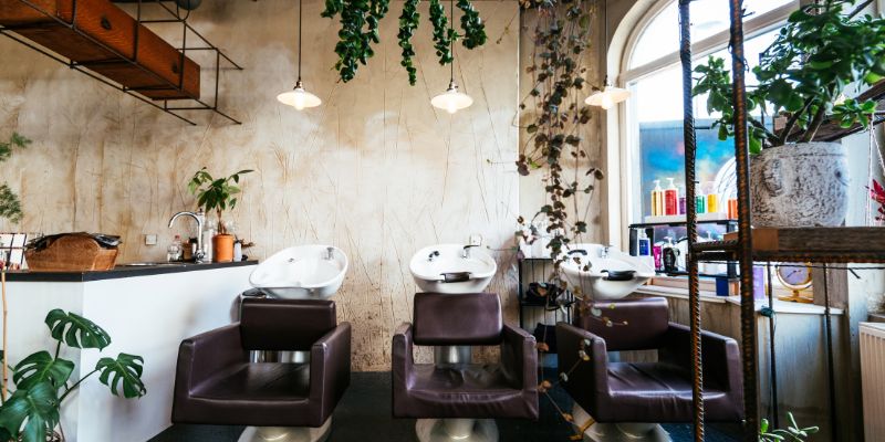 Surround your salon with abundant greenery and quirky elements.