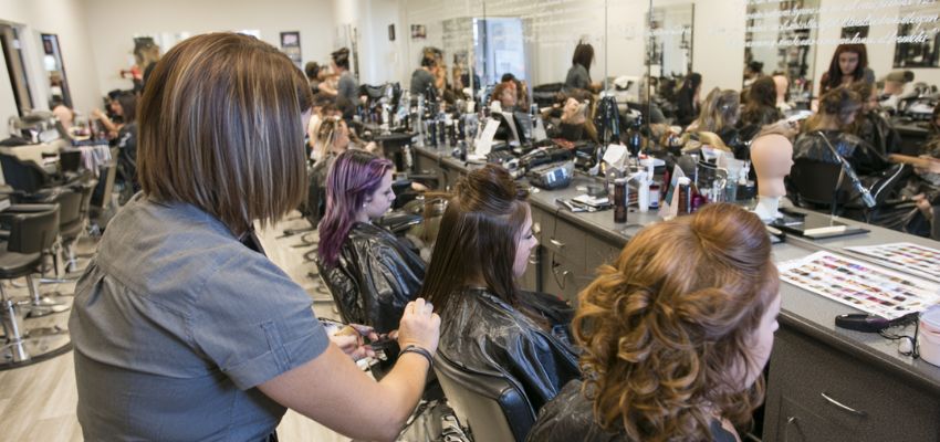 The hairstylist provides an excellent service to his client.