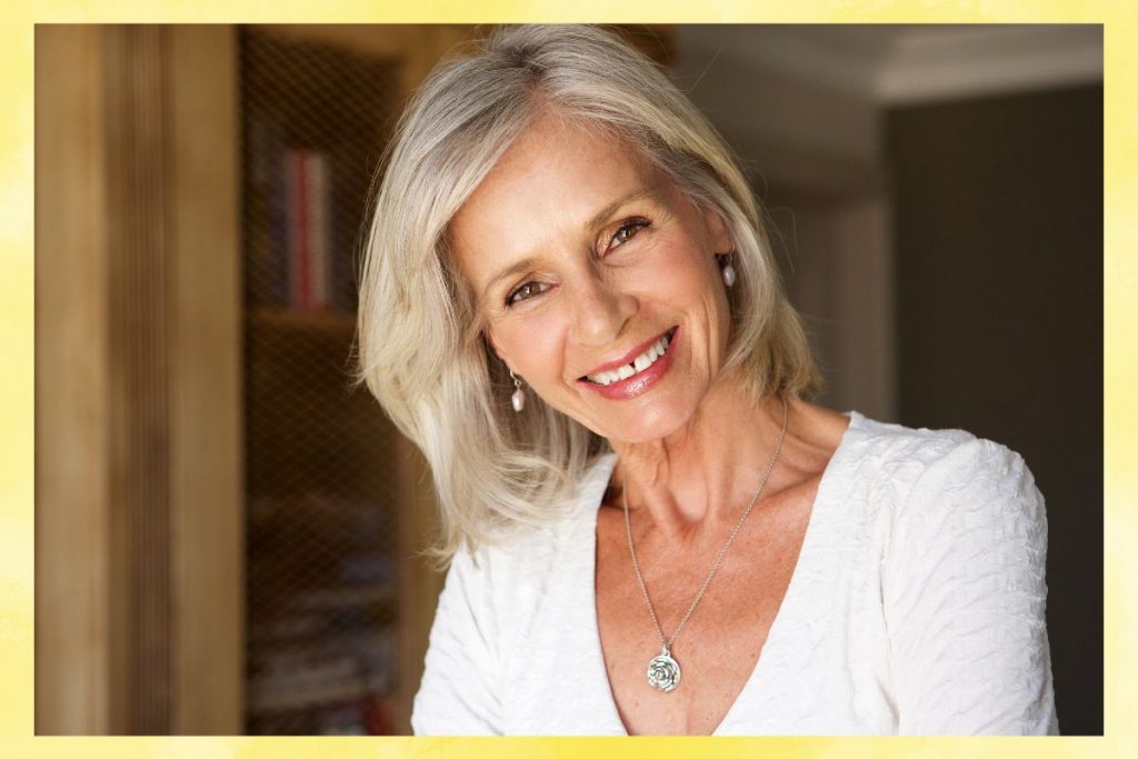 The woman looks confident and gorgeous in her medium-length hairstyles for women over 60.