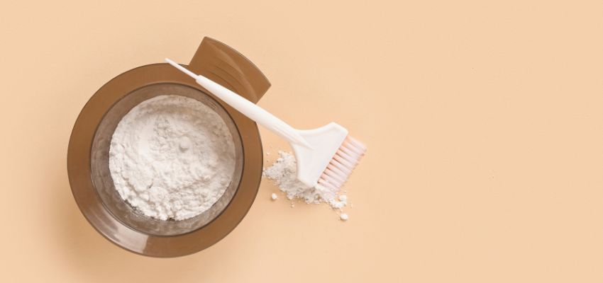 Bleach powder and brush ready for use when exploring what does peroxide do to your hair.